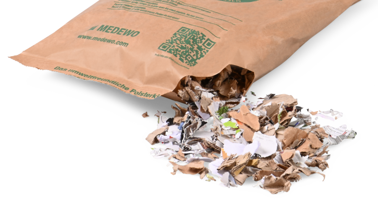 gefüllt mit zerkleinertem Altpapier bzw. -karton