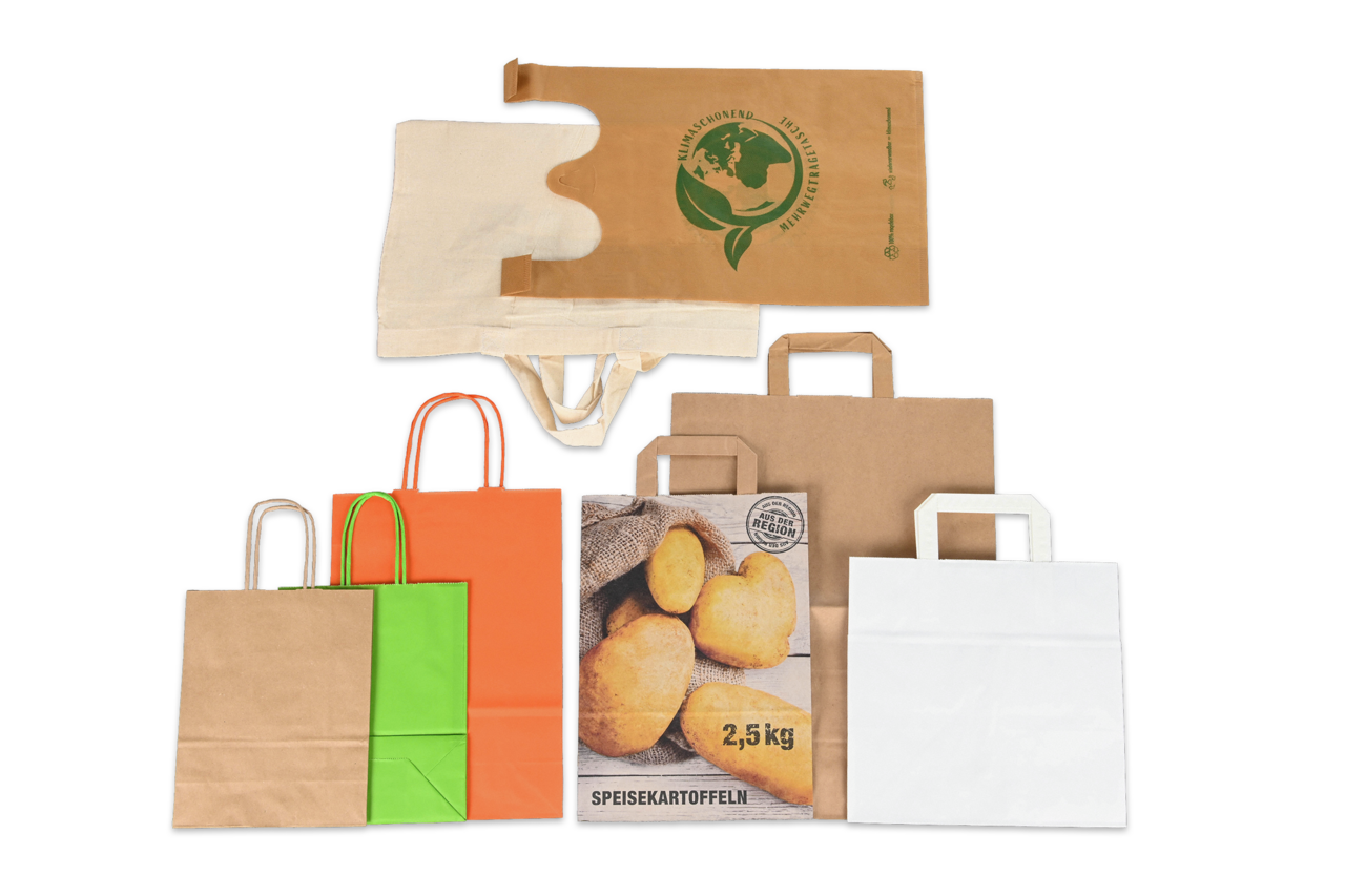Vielfältiges Musterpaket an Tragetaschen – entdecken Sie verschiedene Materialien, Grössen und Designs von Papier- und Stofftaschen für jeden Bedarf.